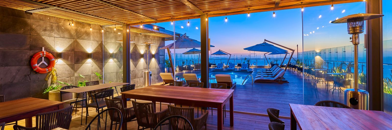 Rooftop pool and terrace at sunset, City Express Plus Ensenada